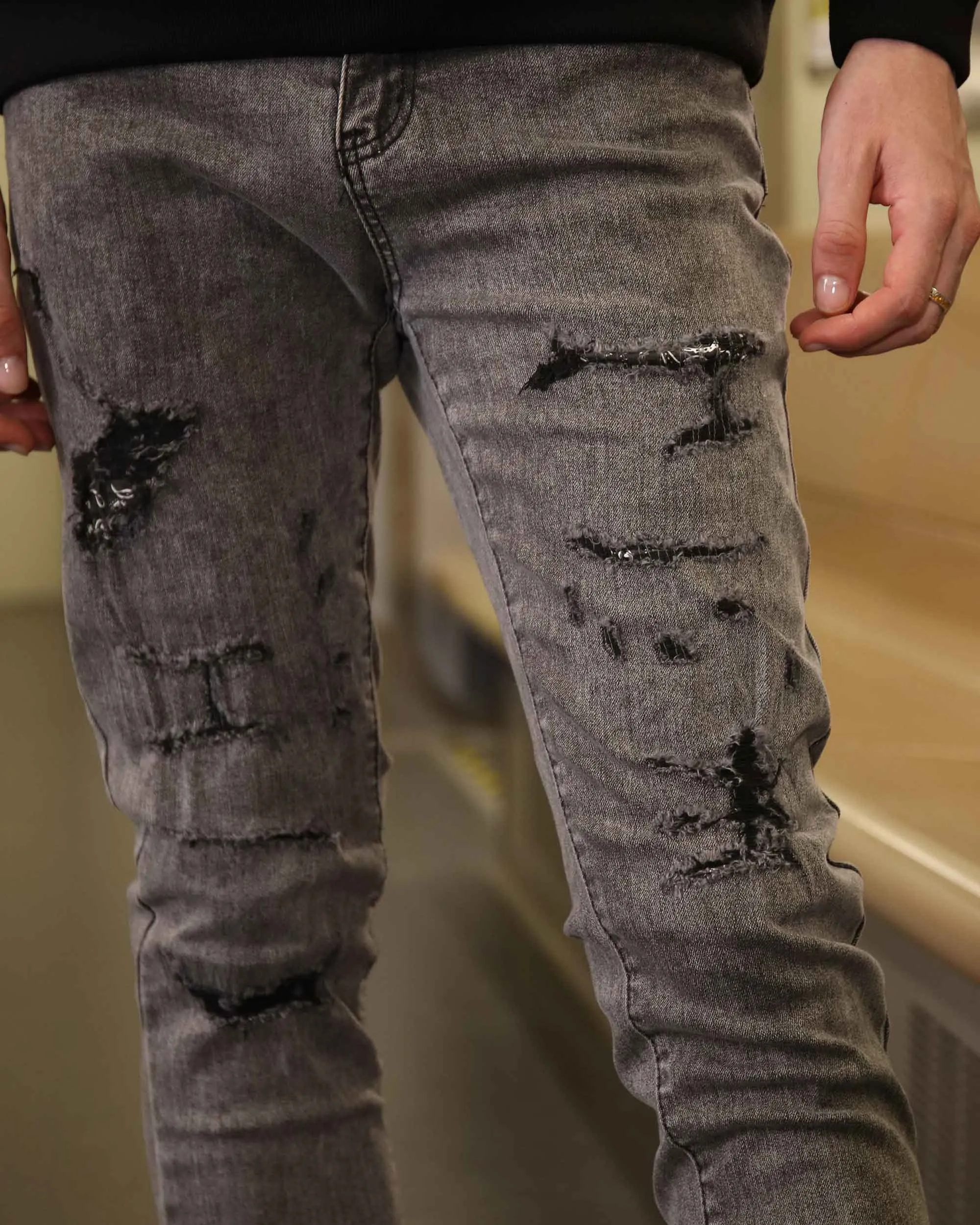 Gray Ripped Jeans with Graffiti-Inspired Style