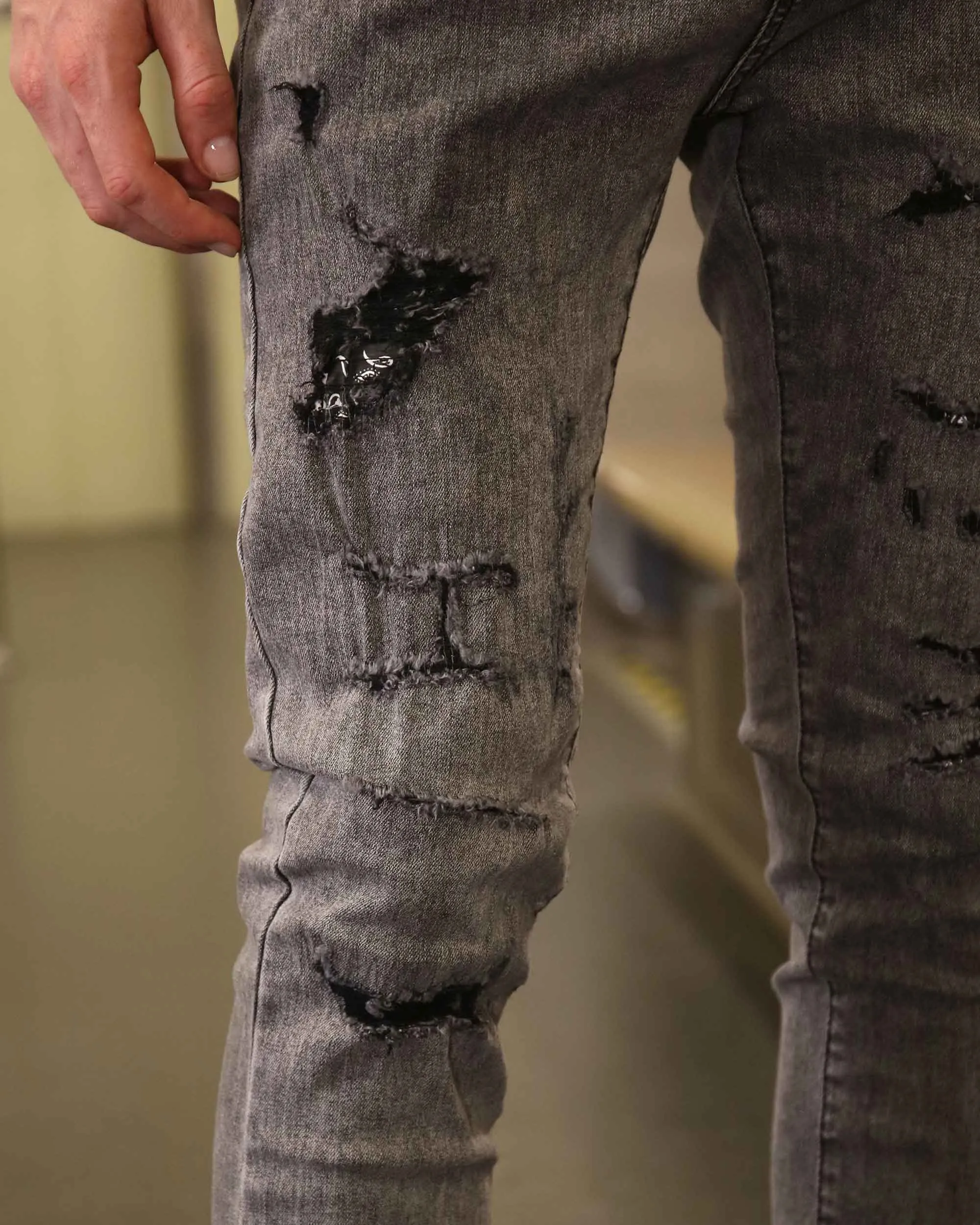 Gray Ripped Jeans with Graffiti-Inspired Style
