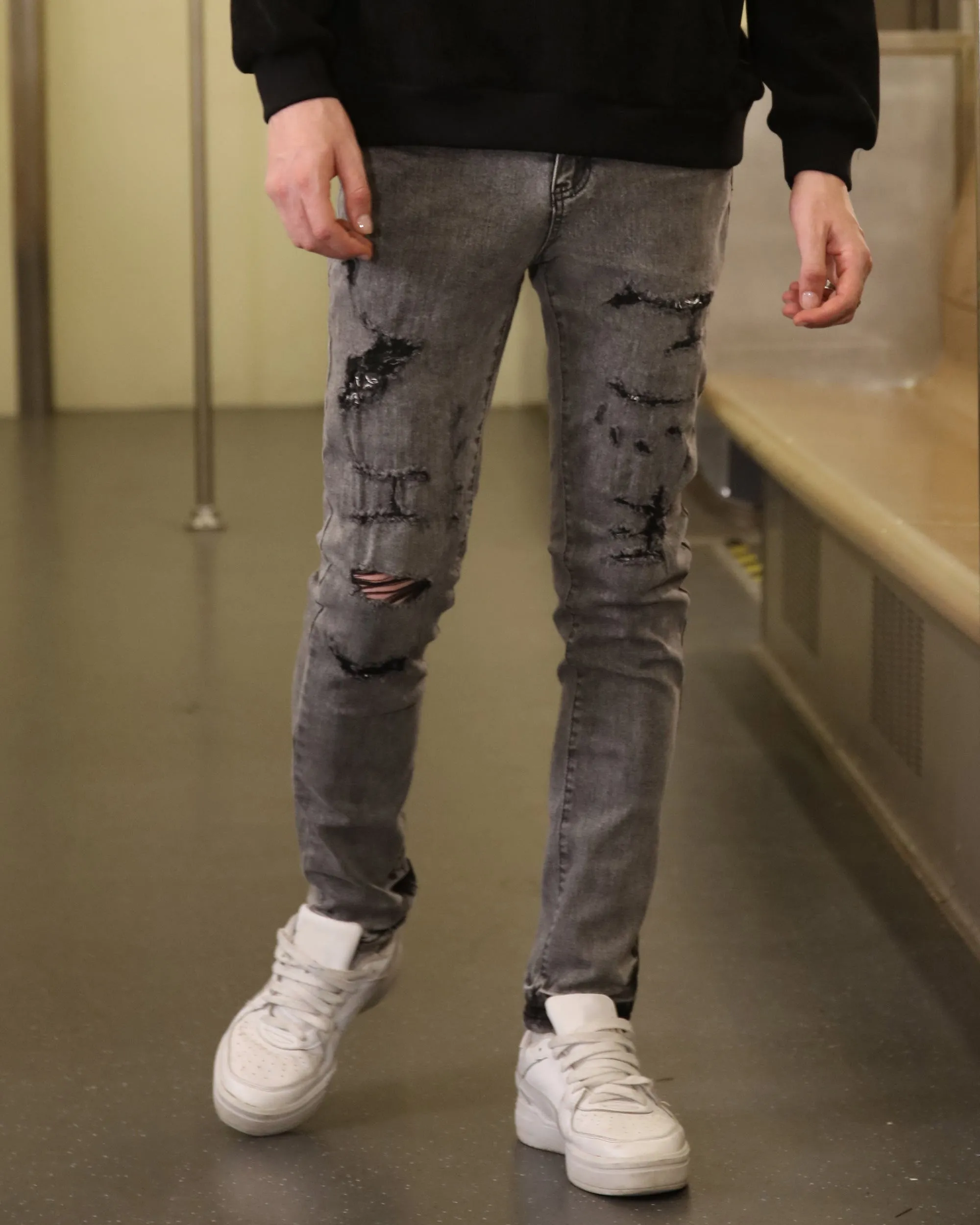 Gray Ripped Jeans with Graffiti-Inspired Style