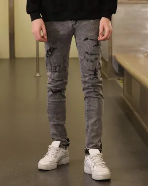 Gray Ripped Jeans with Graffiti-Inspired Style