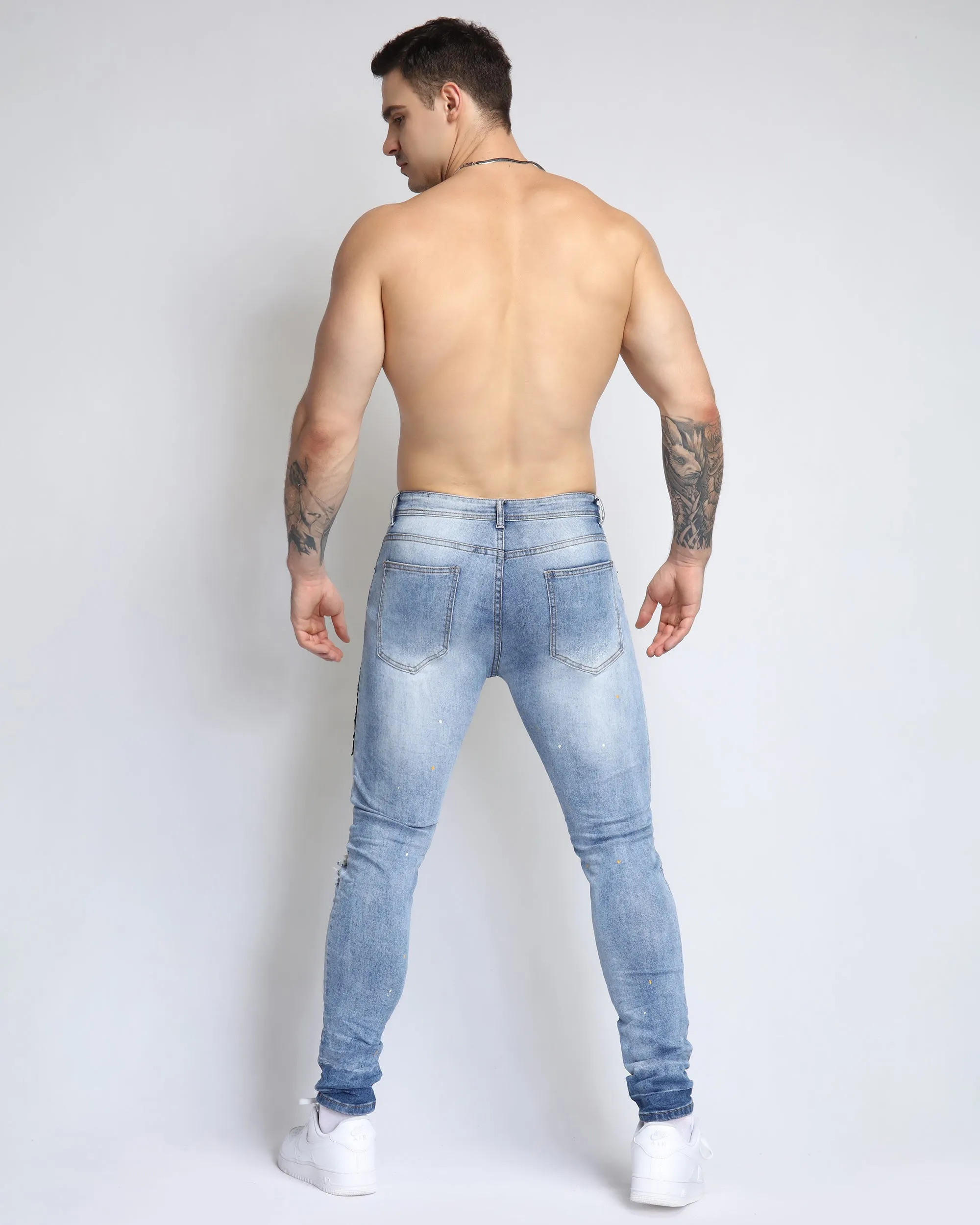 Wild Elegance Blue Ripped Jeans with Delicate Tiger Embroidery